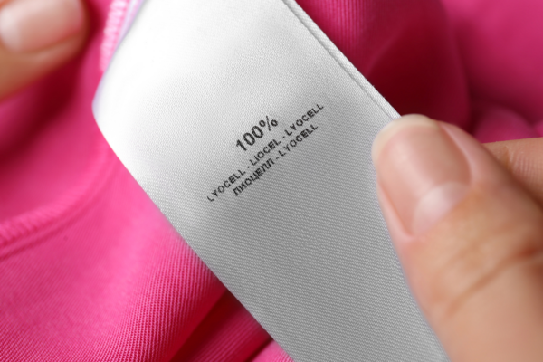 Pink fabric with clothing tag that reads: 100% lyocell