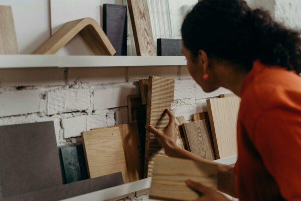 Woman browsing selection of wood samples